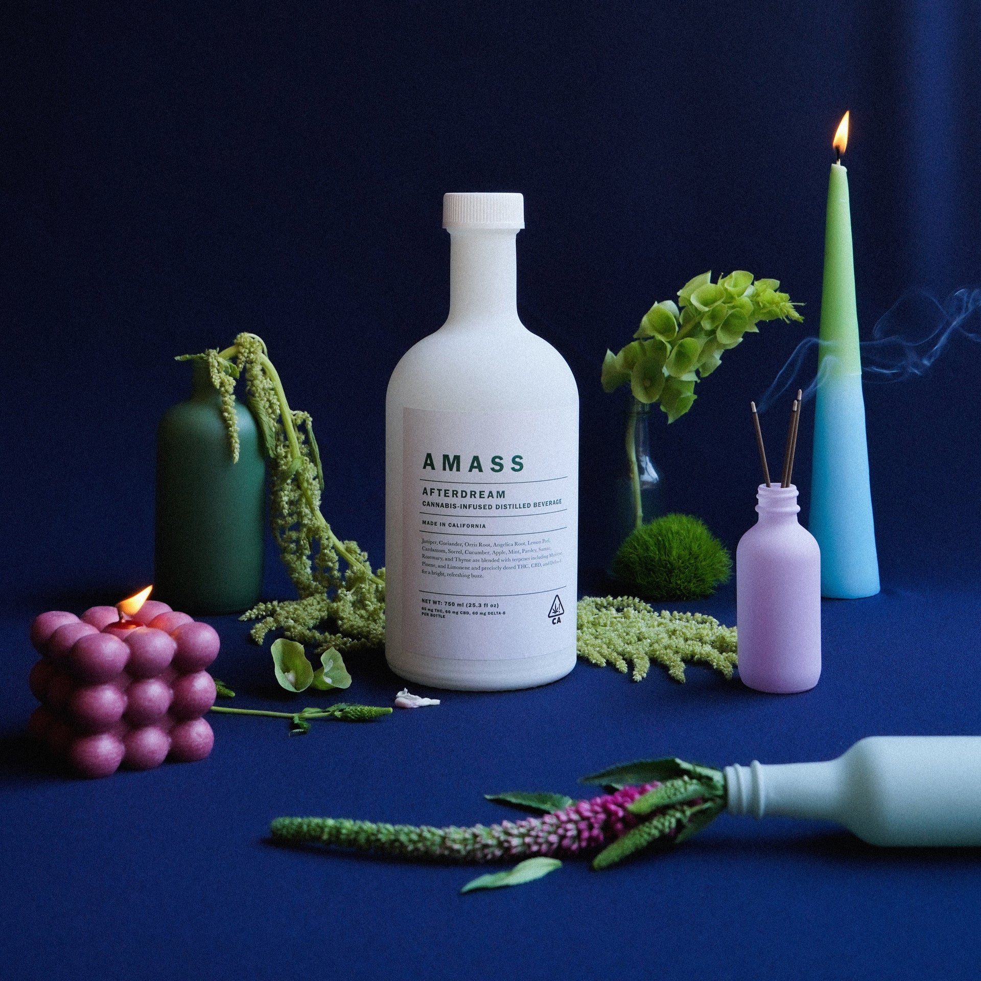 Amass Afterdream distilled thc spirit in a white bottle with green label.